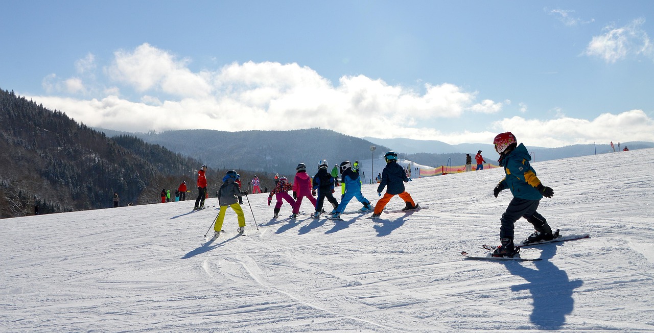 Kids skiing and biking with mentors